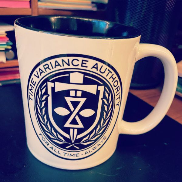 TVA coffee mug White mug with black insides and Time Variance Authority logo with tagline, For All Time. Always.